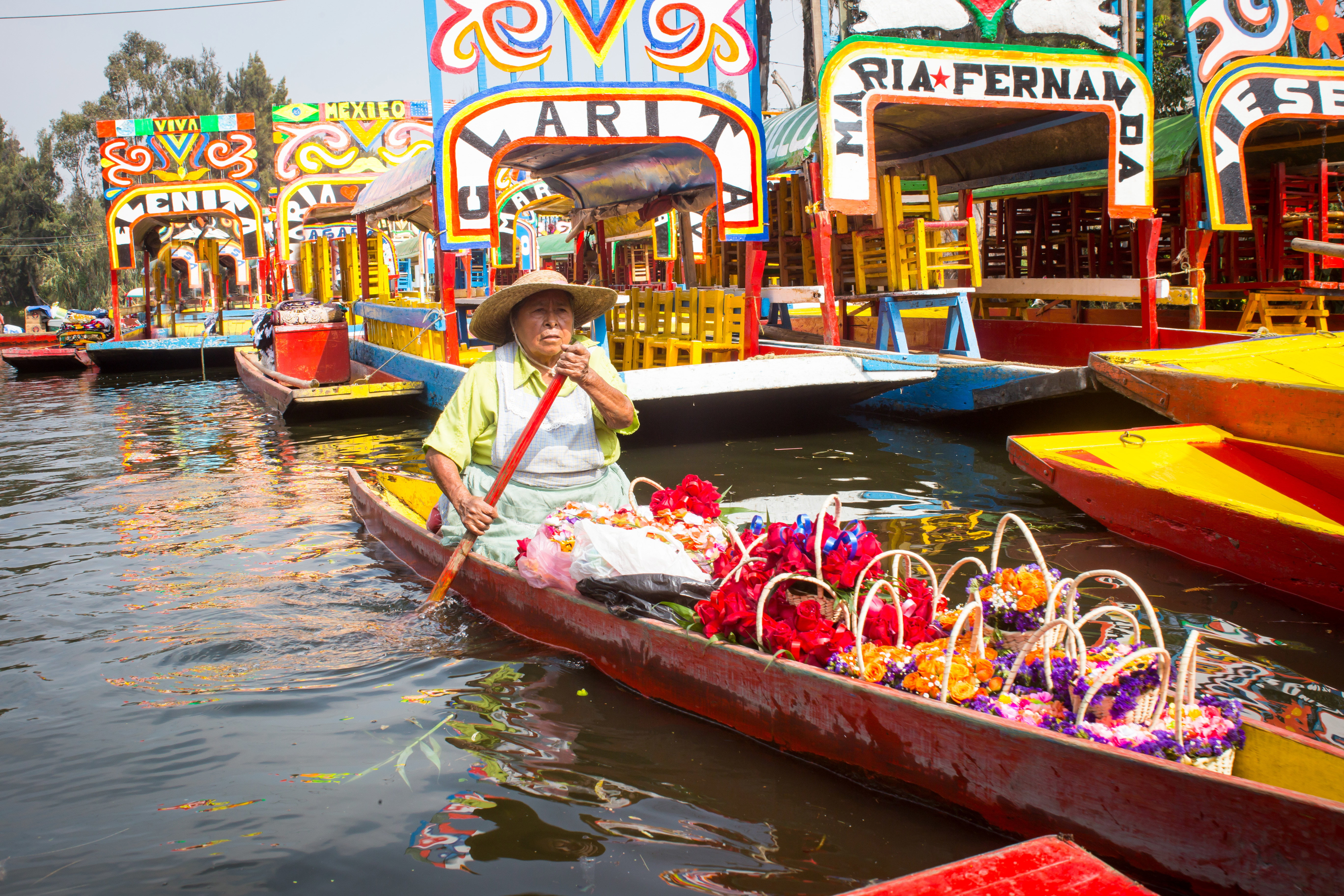 In the area of Xochimilco, Mexico City, locals transport flowers through their canals.