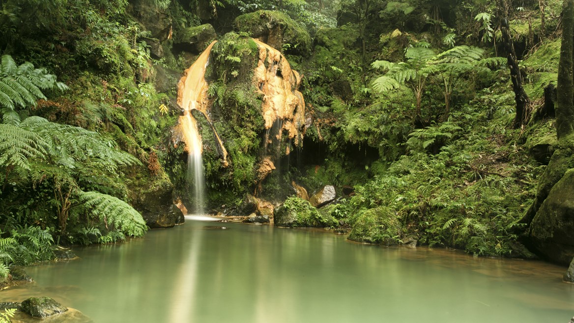 Enjoy a relaxing dip in the Caldeira Velha thermal waters in the Azores.