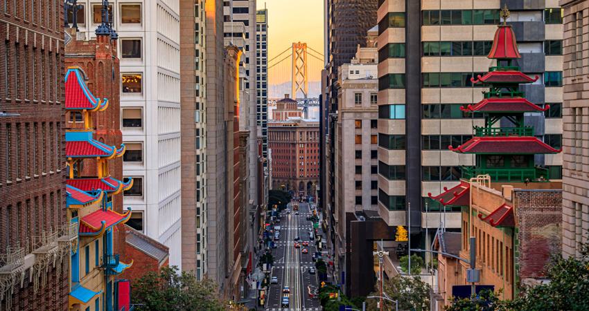 The impressive architecture of Chinatown with the Bay Bridge in the background.