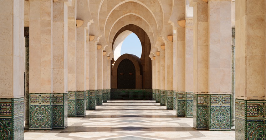 Colonnade of the Hassan II Mosque, with mosaics at the base of each column