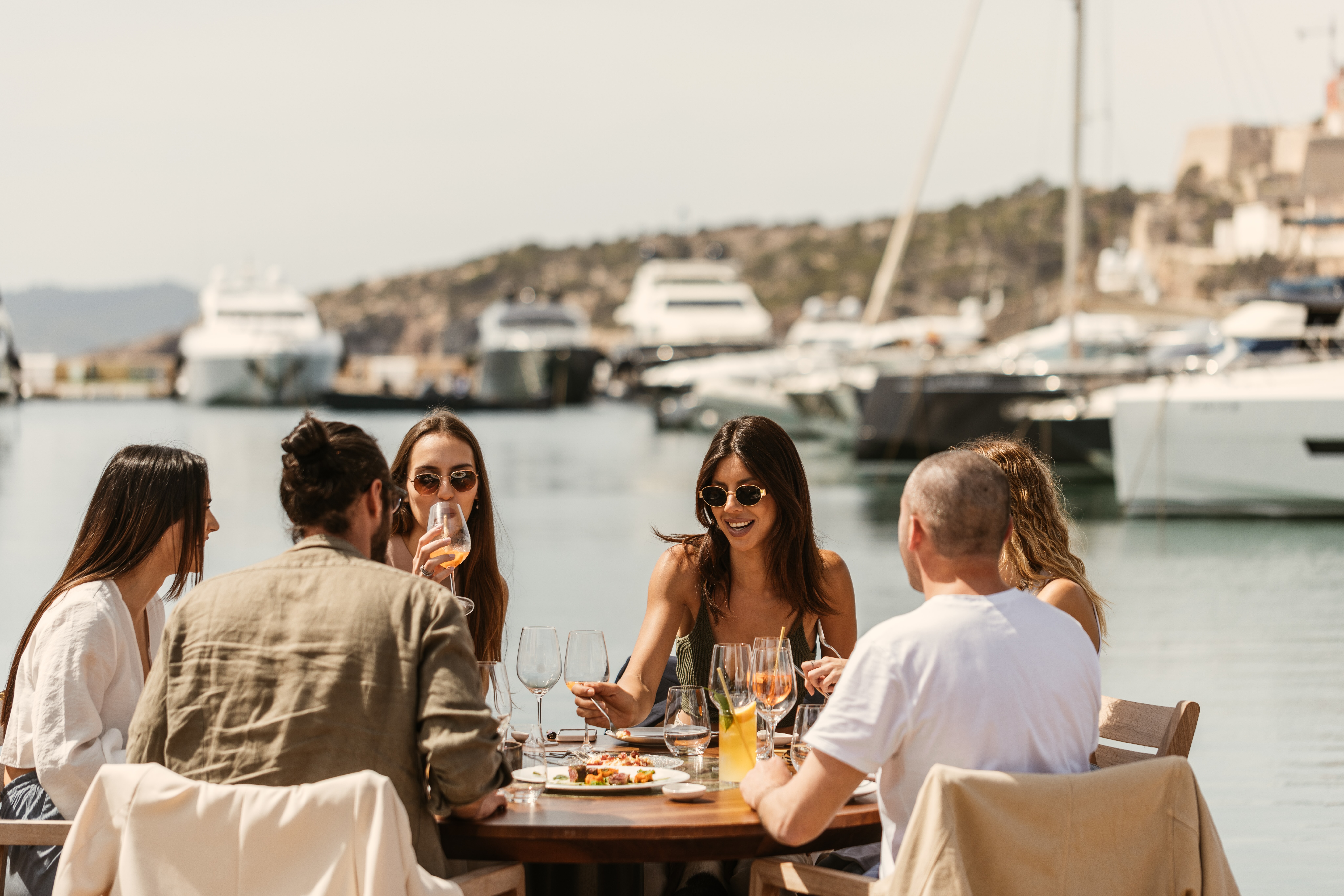 View of the diners enjoying Lado in the port of Ibiza