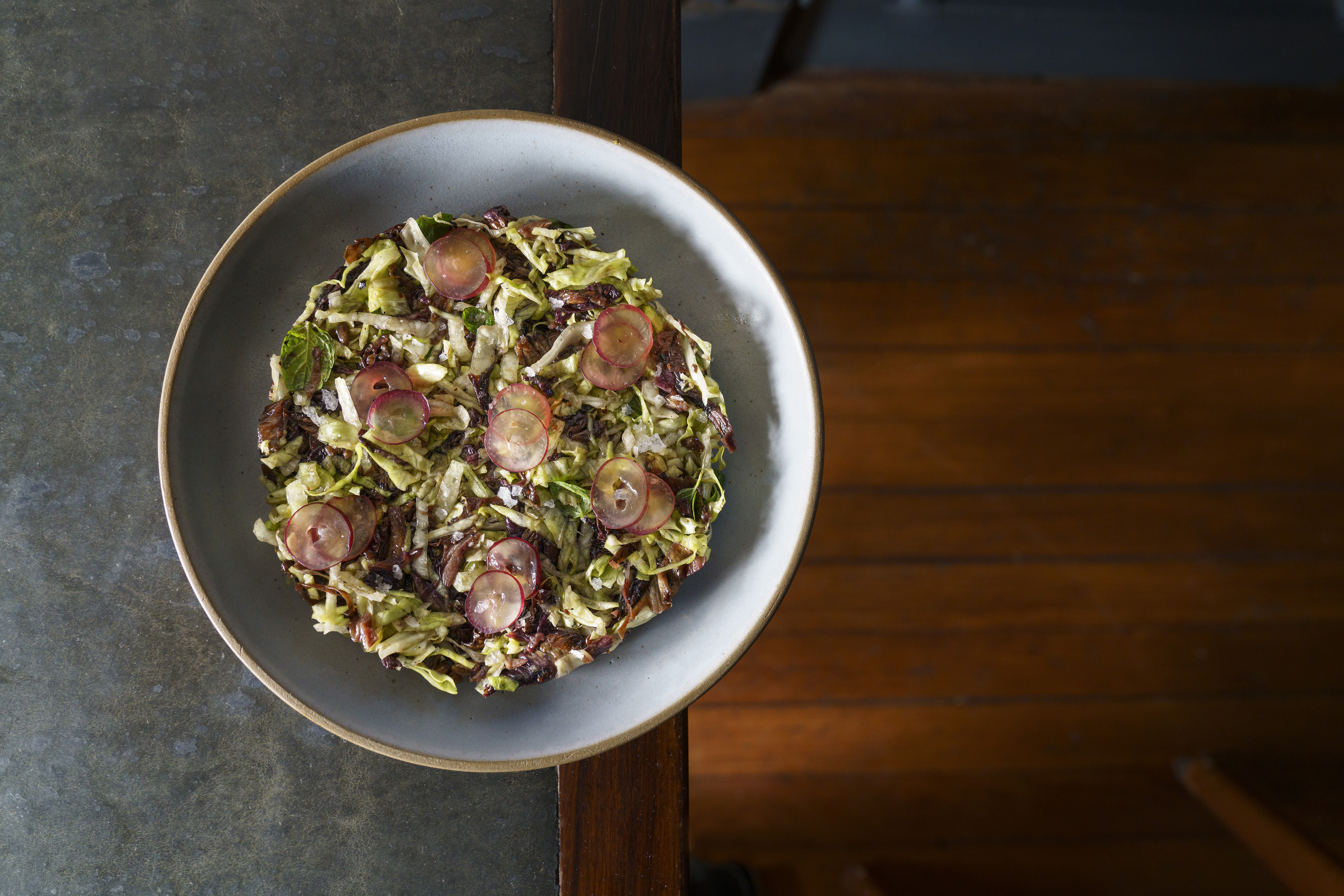 One of Mengano's vegetable dishes, presented on an icy grey plate.