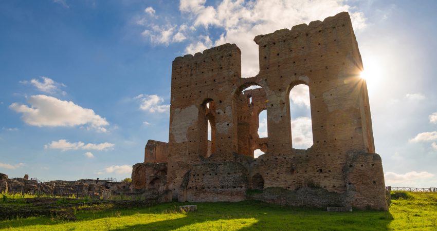 One of the monumental walls of the Villa dei Quintili, the evening sun shines through the windows