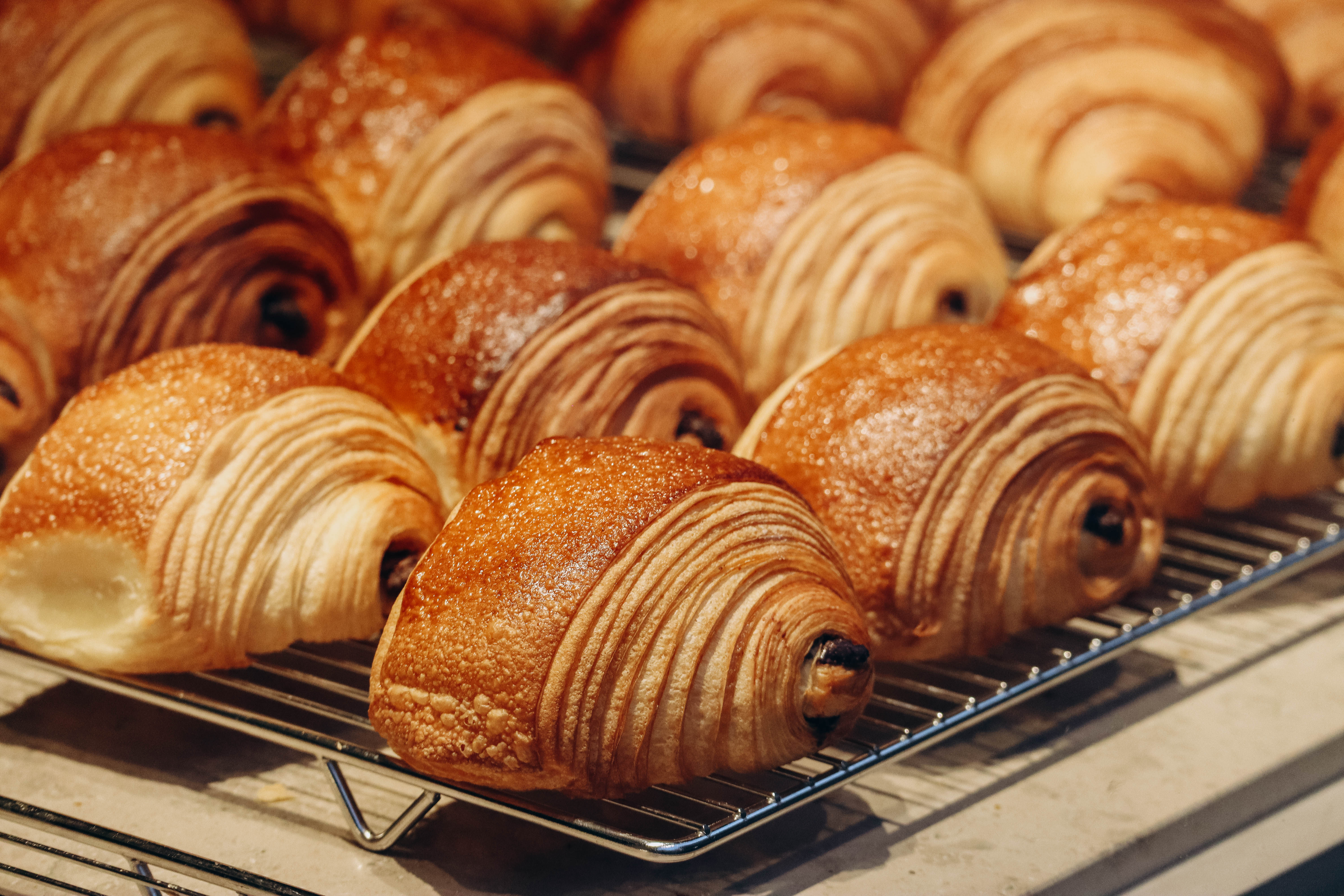 The best bakeries in Paris. Pictured here is a tray of freshly baked chocolate-filled croissants.