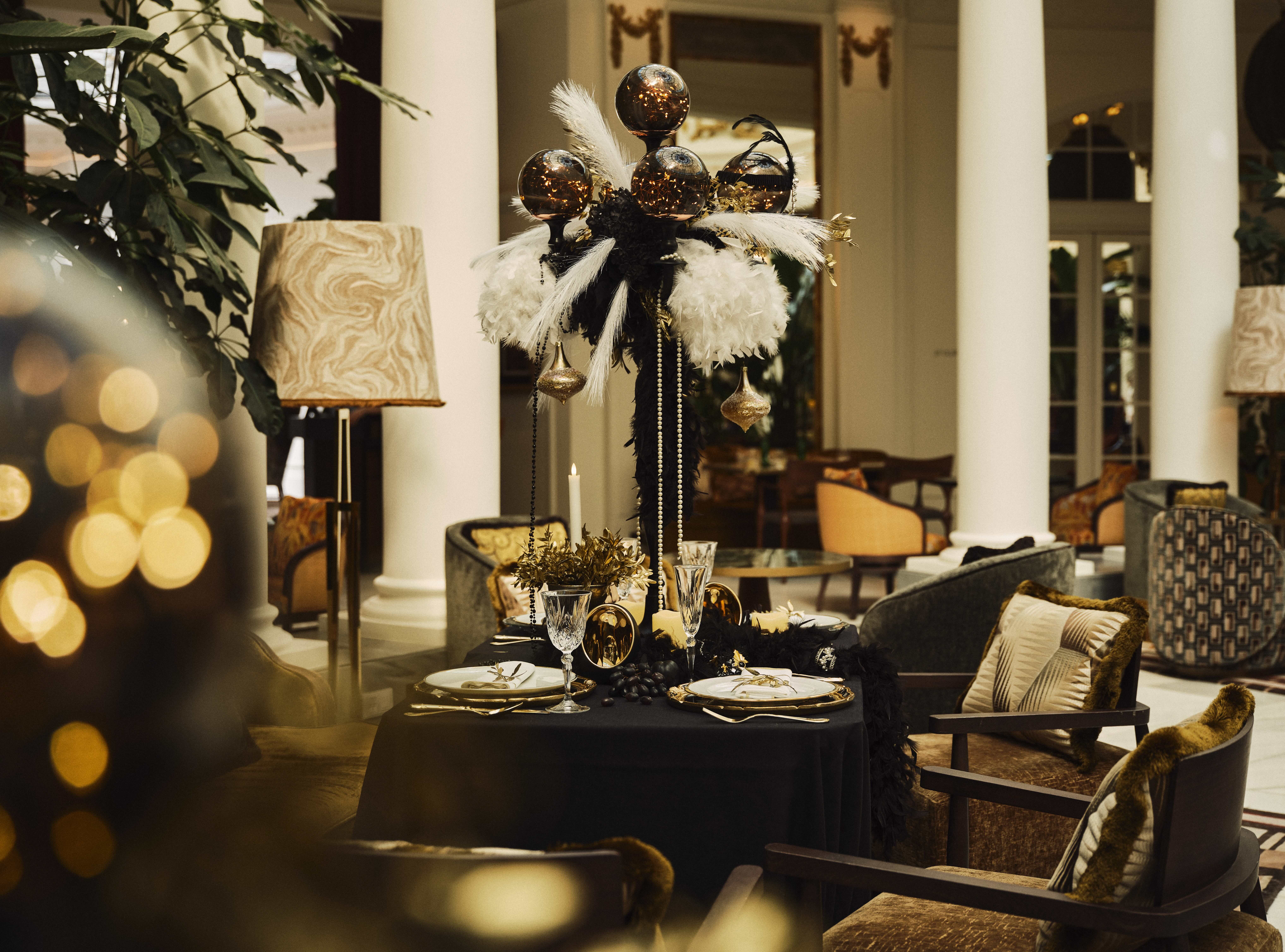 The Palace Hotel lounge at Christmas, decorated in green, white, and gold