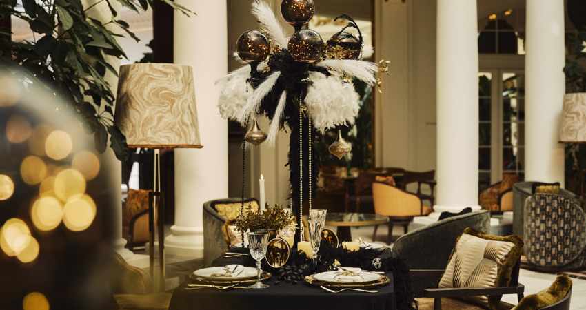 The Palace Hotel lounge at Christmas, decorated in green, white, and gold